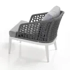 Vnitřní a venkovní obývací pokoj se 2 křesly, 1 pohovkou a 1 konferenčním stolkem - Sortir Viadurini