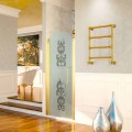 Scirocco H Caterina zlatý klempířský ohřívač z mosazi, design